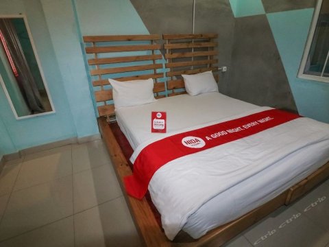 棉兰海尔维科塔尼达酒店(Nida Rooms Riatur Helvetia Medan Kota)