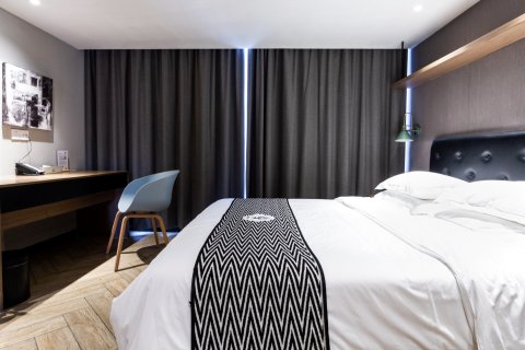 隅花原设计酒店(海口美兰机场鸿洲江山店)