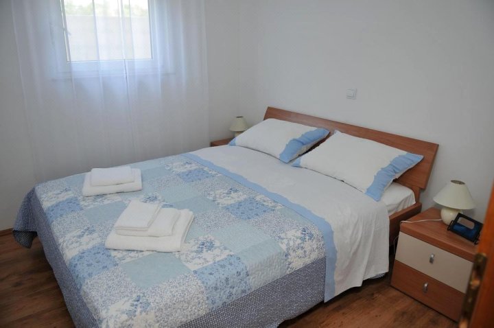 Teuta Apartments - a beach and a sea view