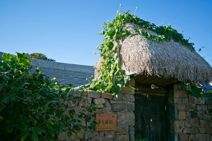 荣成海草房唐乡酒店