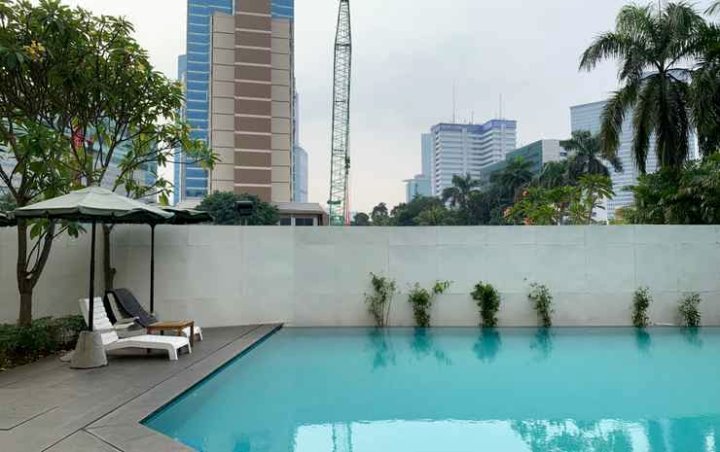 Simple and Comfy 1Br at Palm Court Apartment by Travelio
