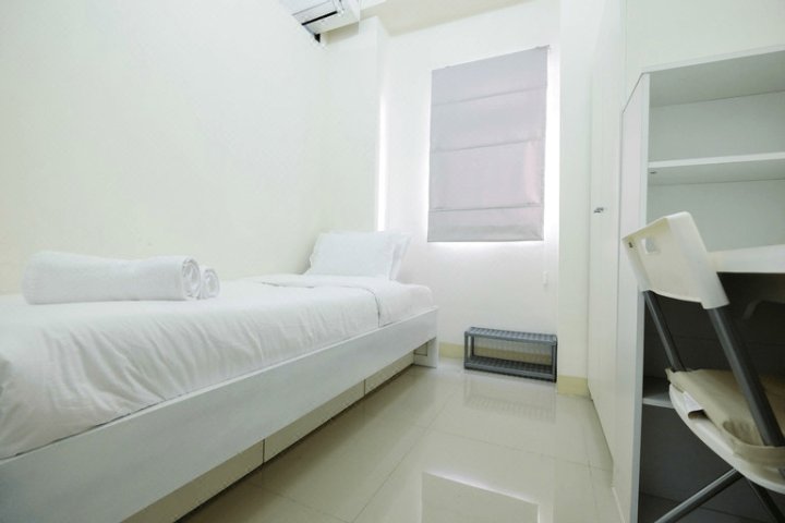 Tranquil 2BR @ Green Pramuka Apartment By Travelio