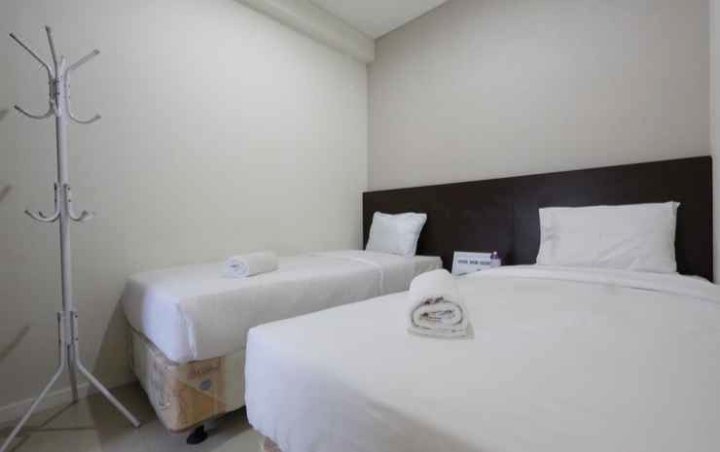 Clean and Cozy 2Br Apartment at Parahyangan Residence by Travelio