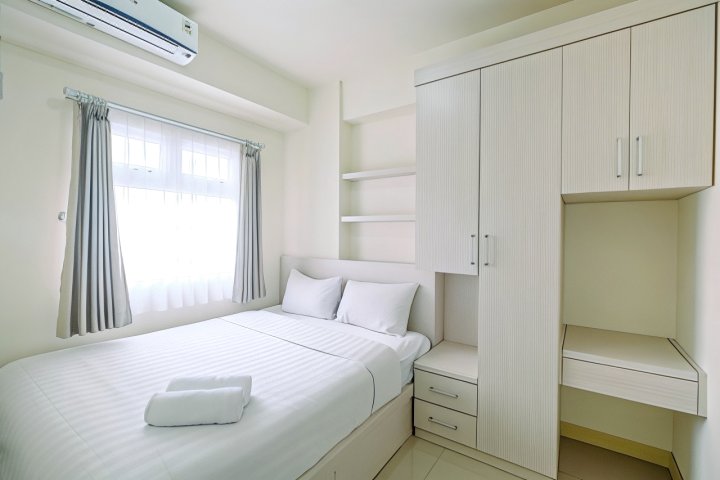 Chic and Cozy 2BR Apartment at Green Pramuka City By Travelio