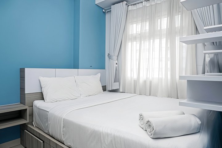 Relaxing and Warm 2BR @ Green Pramuka City Apartment By Travelio