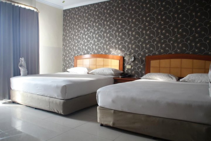 美娜多库普利克贝拉布汗尼达酒店(Nida Rooms Kompleks Pelabuhan Manado)