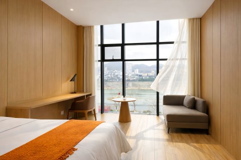 江景·国际WOMENSMOVIEWOWMOVEWOWROMANDM设计酒店(石泉县古城店)